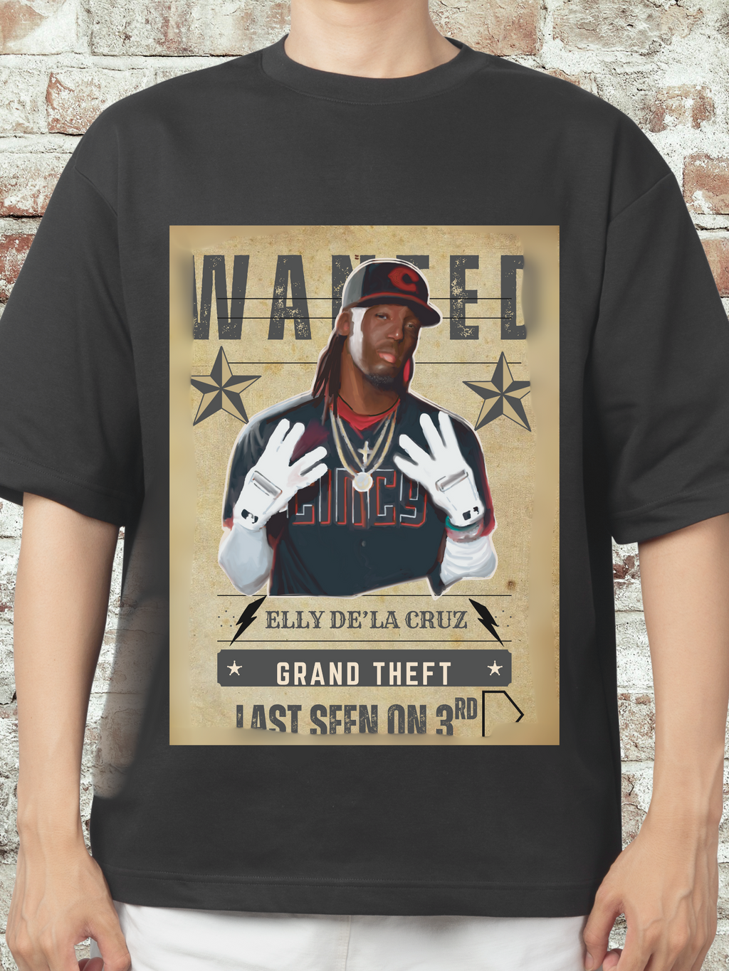 Graphic T-shirt featuring a caricature of Elly D Cruz with a 'Wanted' poster design, themed around stealing third base, popular with Cincinnati baseball fans.