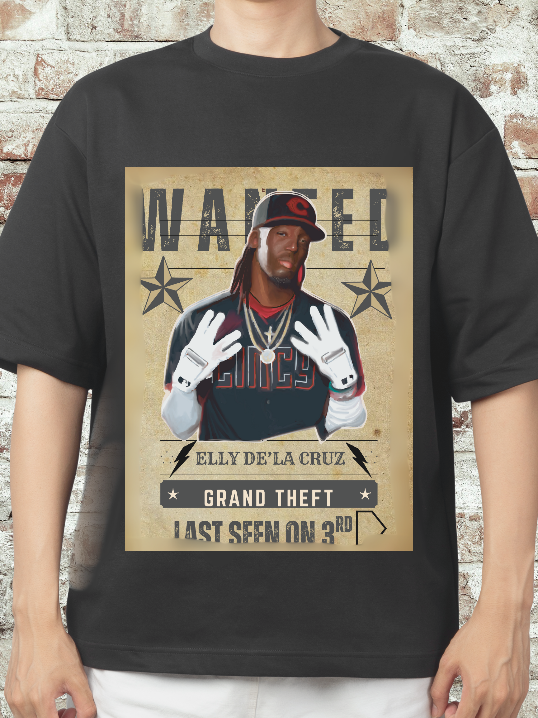 Graphic T-shirt featuring a caricature of Elly D Cruz with a 'Wanted' poster design, themed around stealing third base, popular with Cincinnati baseball fans.