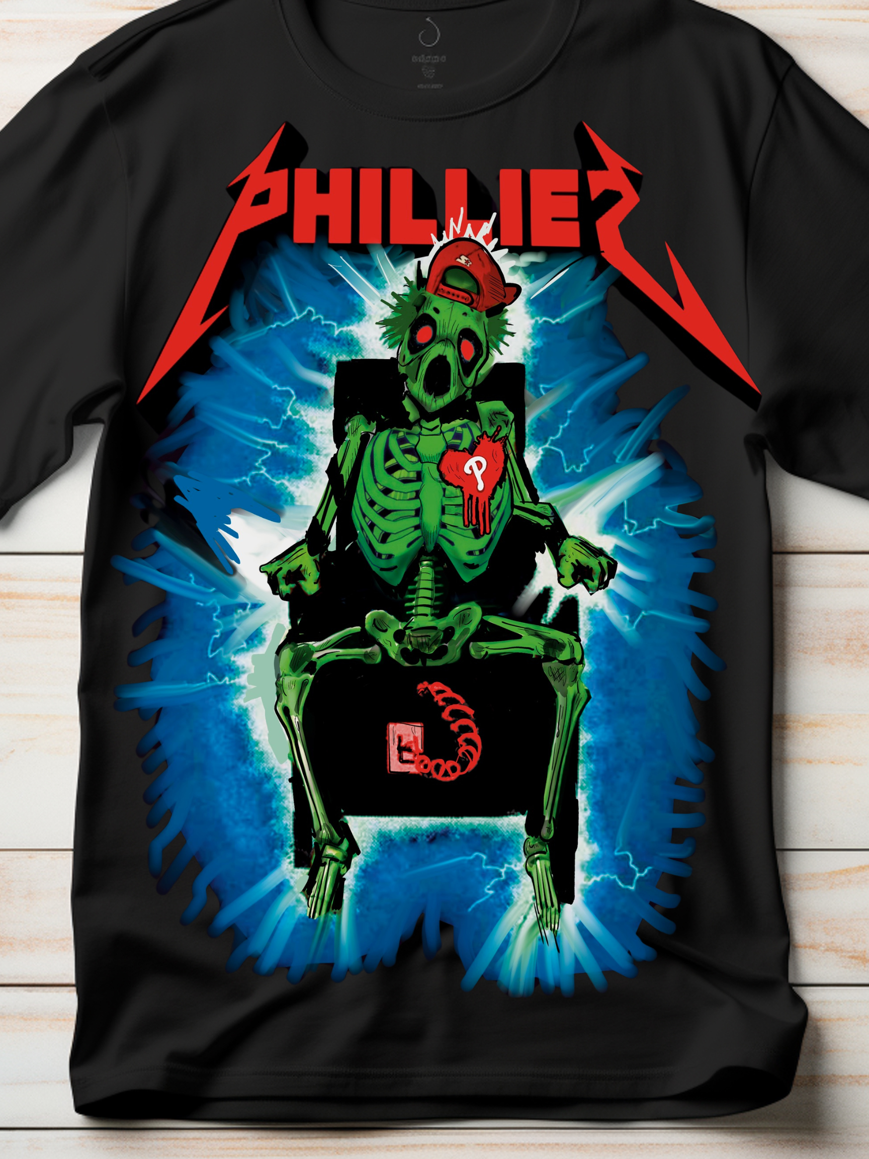 Bold black t-shirt featuring a neon green skeleton getting electrocuted in a chair, with a red "P" heart patch and backwards cap. Surrounded by blue lightning bolts and the word “PHILLIES” in a heavy metal-inspired font. Perfect for hardcore Philly baseball fanatics who love edgy fan gear.