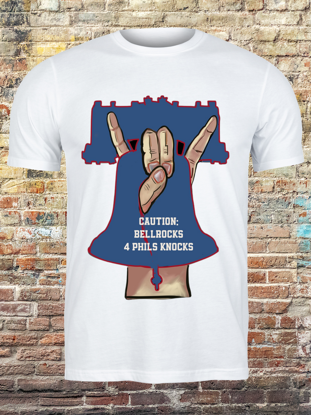 White t-shirt with a bold graphic of a hand gesture forming a bell shape inside a Liberty Bell outline, with text that reads “Caution: Bellrocks 4 Phils Knocks